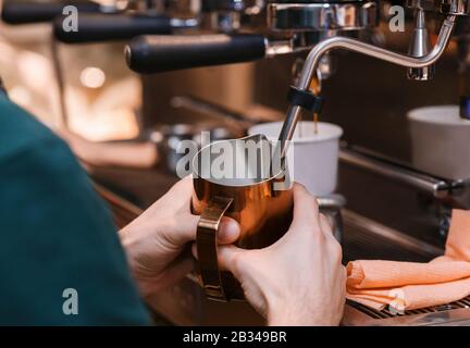 Male Hands Making Coffee Drink Using Coffee-Machine In Cafeteria Stock Photo