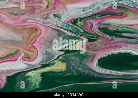 Closeup shot of abstract patterns created with bright paints mixed in the water Stock Photo