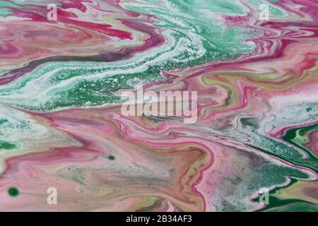 Closeup shot of abstract patterns created with bright paints mixed in the water Stock Photo