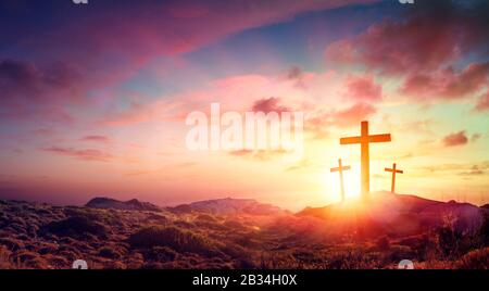 Crucifixion Of Jesus Christ Three Crosses On Hill At Sunset Stock Photo