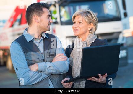 engineers with laptop outside field Stock Photo