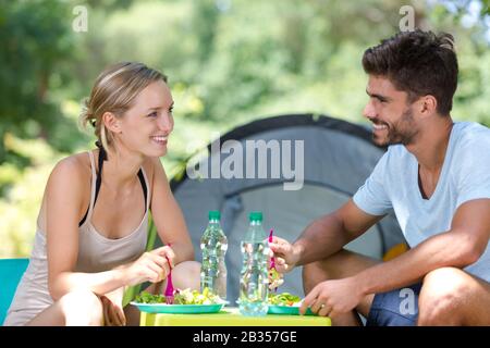 happy young couple enjoys a sunny day in nature Stock Photo
