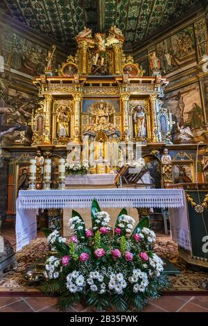 Main altar, 17th century, at Saint Michael the Archangel Church, UNESCO World Heritage Site, in Binarowa, Malopolska, Poland Stock Photo