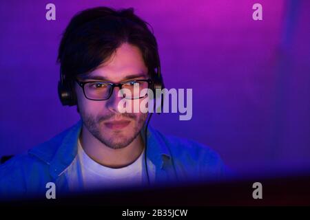 Student Guy At Desktop PC Playing Game Online At Home Stock Photo