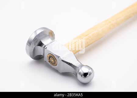Closeup of a chasing hammer lying on a white background Stock Photo