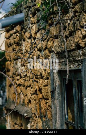 Paphos Cyprus March 03, 2020 View of an old abandoned house being destroyed on the streets of Paphos in the afternoon Stock Photo