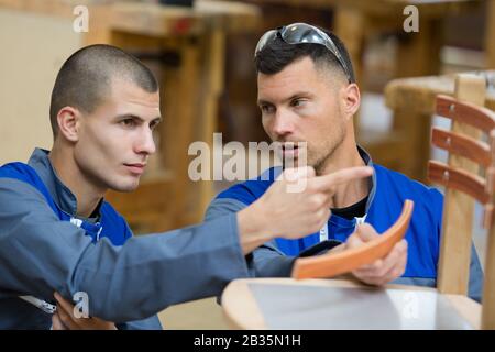 two artisans having a discussion Stock Photo