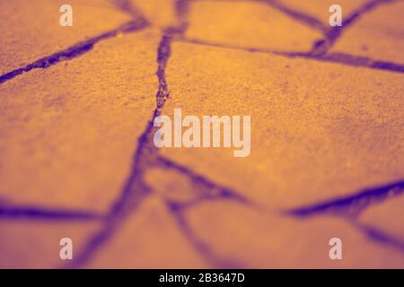 Orange wild stone pavement floor. Irregular shapes pattern. Stock Photo