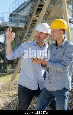 two engineers are checking something outdoors Stock Photo