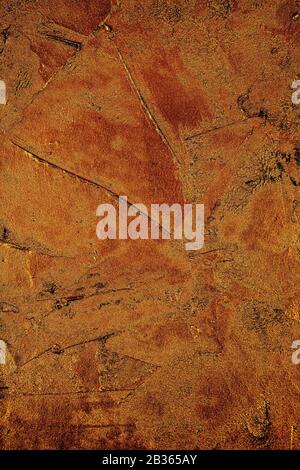 closeup of a golden textured plastered surface to be used as a background Stock Photo
