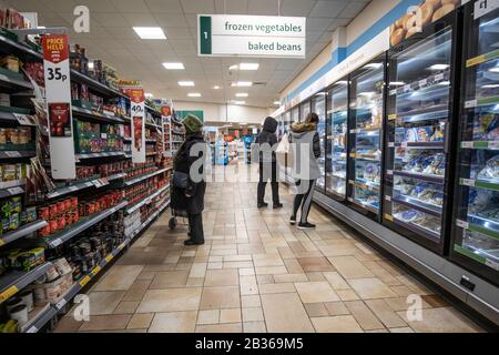 Shoppers at a Morrisons supermarket go about their daily shop, at one of the fourth largest chains of supermarkets in the UK Stock Photo