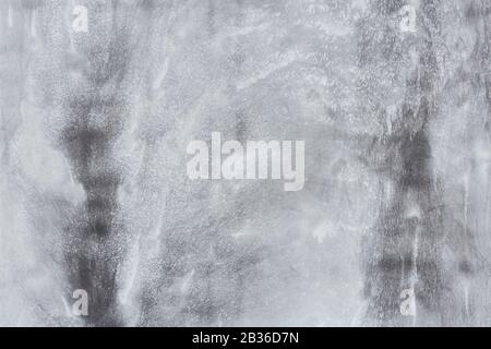 A smooth surface of a concrete formwork wall with various shades of grey, for background Stock Photo