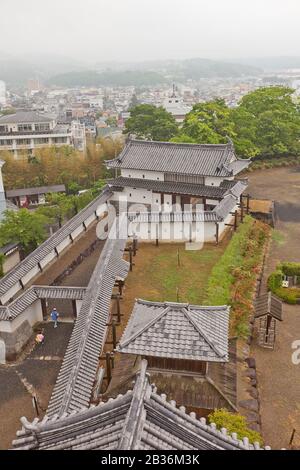 Main gate and protective walls of Shiroishi Castle, Japan from main keep. Castle was founded in 1591 by Gamo Ujisato and dismantled in 1875 Stock Photo