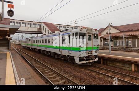 Japan Rail (JR East) KiHa 100 Series trains in the rain at Odate