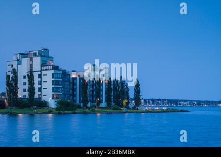 Sweden, Vastmanland, Vasteras, new residential buildings of the Munkangen harborfront, dusk Stock Photo