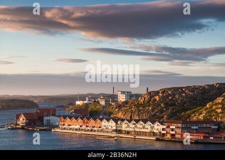 Sweden, Bohuslan, Kungshamn, high angle view of coastal houses and factory Stock Photo