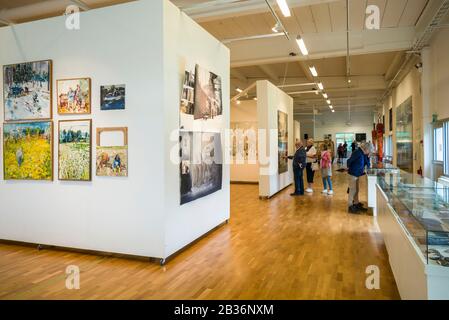 Sweden, Varmland, Karlstad, Sandgrund Karlstad, former dancehall now a gallery for famed Swedish artist Lars Lerin, interior with visitors Stock Photo