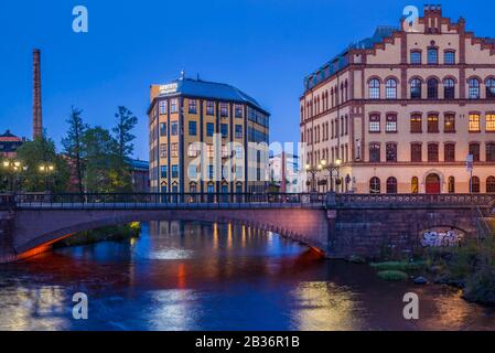 Sweden, Southeast Sweden, Norrkoping, early Swedish industrial town, Arbetets Museum, Museum of Work in former early 20th century mill building, dusk Stock Photo