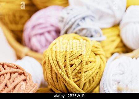 White, yellow, mustard, gray cotton thread balls background Stock Photo