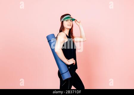 woman in sportswear isolated on pink background - Fitness sport healthy lifestyle concept Stock Photo