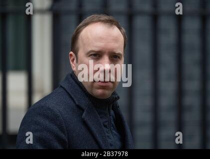 Downing Street, London, UK. 4th March 2020. Serious looking Matt Hancock MP, Secretary of State for Health and Social Care, leaving 10 Downing Street before the PM departs for weekly PMQs. Credit: Malcolm Park/Alamy. Stock Photo