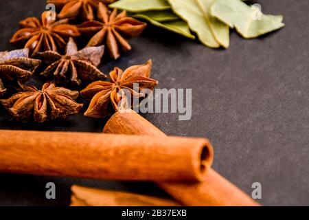 star anise, cinnamon sticks, cones, christmas spices background Stock Photo