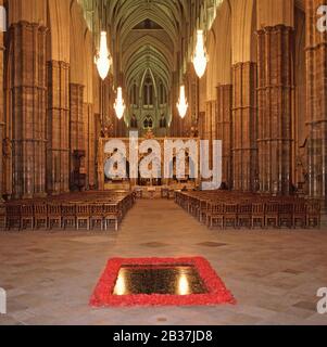 Interior of Westminster Abbey at night the Nave & British Grave or Tomb of The Unknown Warrior honour the unknown dead of First World War London UK Stock Photo