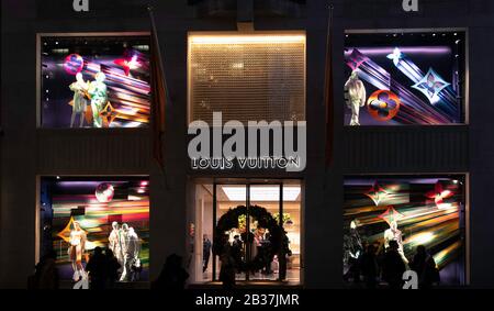 The shop front of Louis Vuitton in New Bond Street, London at night. Stock Photo
