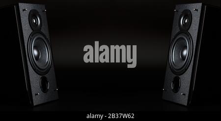 Two audio speakers with free space between them on a black background. The concept of stereo sound, Free space Stock Photo