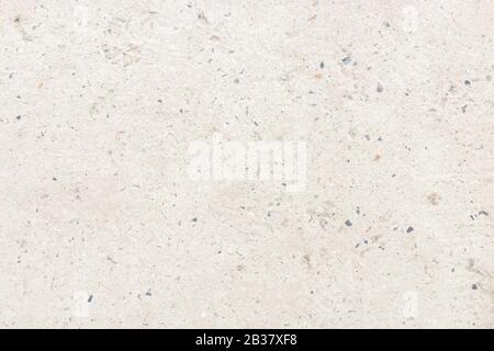 white concrete wall with small stones in it. cold minimalist background design Stock Photo