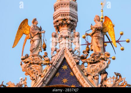 The winged lion of Saint Mark and Angels on Basilica di San Marco, Venice, Veneto, Italy. Stock Photo