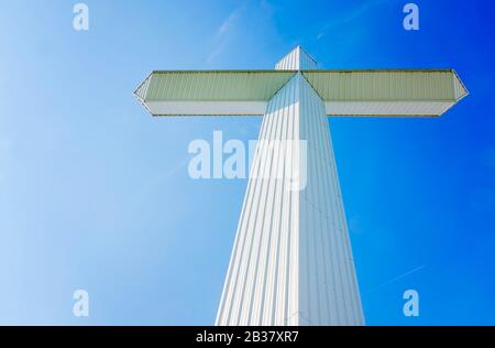 A 110-foot, 16-ton white cross stands outside Berry’s Seafood and Catfish House, Aug. 20,  2019, in Florence, Mississippi. Stock Photo