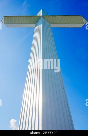 A 110-foot, 16-ton white cross stands outside Berry’s Seafood and Catfish House, Aug. 20,  2019, in Florence, Mississippi. Stock Photo