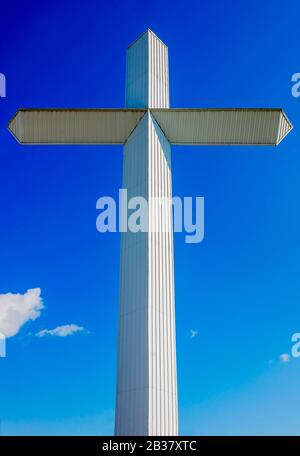 A 110-foot, 16-ton white cross stands outside Berry’s Seafood and Catfish House, Aug. 20,  2019, in Florence, Mississippi. Stock Photo