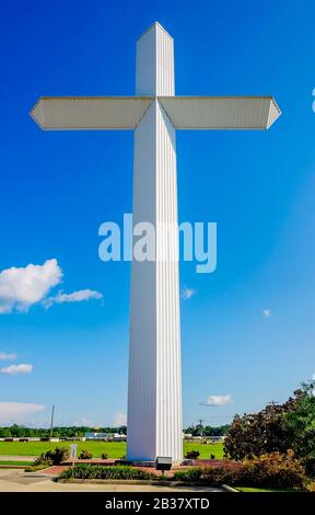 A 110-foot, 16-ton white cross stands outside Berry’s Seafood and Catfish House, Aug. 20,  2019, in Florence, Mississippi. Stock Photo