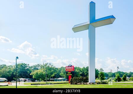 A 110-foot, 16-ton white cross stands outside Berry’s Seafood and Catfish House, Aug. 20,  2019, in Florence, Mississippi. Stock Photo