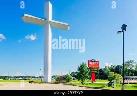 A 110-foot, 16-ton white cross stands outside Berry’s Seafood and Catfish House, Aug. 20,  2019, in Florence, Mississippi. Stock Photo