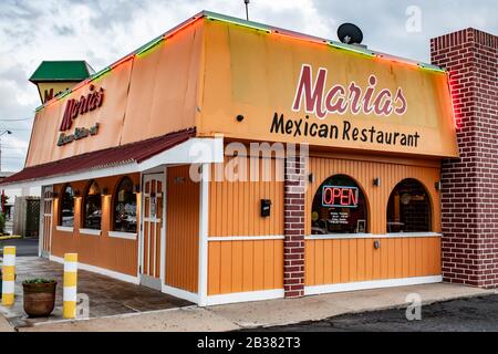 Charlotte, NC/USA - May 10, 2019: Medium closeup of 'Marias Mexican Restaurant' showing restaurant with brand/logo on two sides and neon 'open' sign. Stock Photo