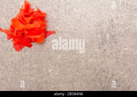 Pickled sushi ginger slices isolated on stone background, top view Stock Photo
