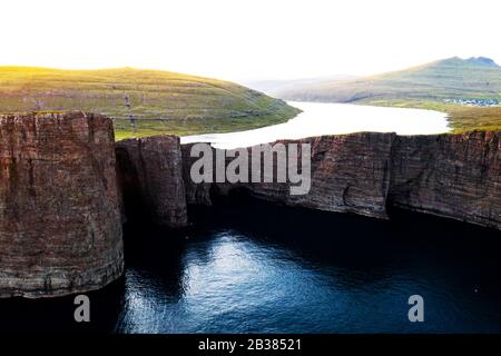 Incredible view of Sorvagsvatn lake on cliffs of Vagar island in sunset time, Faroe Islands, Denmark. Landscape photography Stock Photo