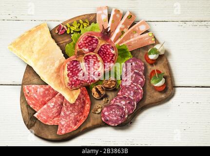 Typical Italian appetizers on woooden plate.Top view Stock Photo