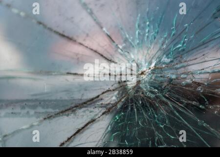 Crack on the windshield of the car glass. Damage from a flying stone. Stock Photo