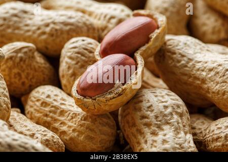 Peeled peanut on well peanuts. Peanuts, for background or textures. Stock Photo