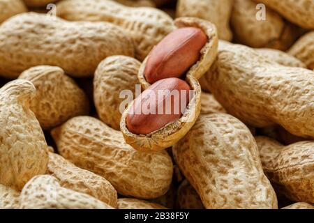Peeled peanut on well peanuts. Peanuts, for background or textures. Stock Photo