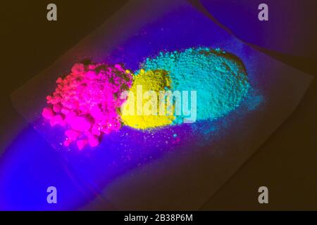 Fluorescent organic materials of red, yellow and green color for production OLED . Stock Photo