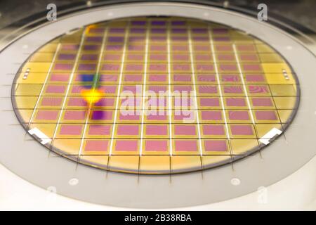 Silicon wafer with microchips fixed in the holder is on the chuck and ready for process cleaning. Stock Photo