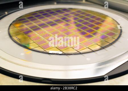 Silicon wafer with microchips fixed in the holder is on the chuck and ready for process cleaning. Stock Photo