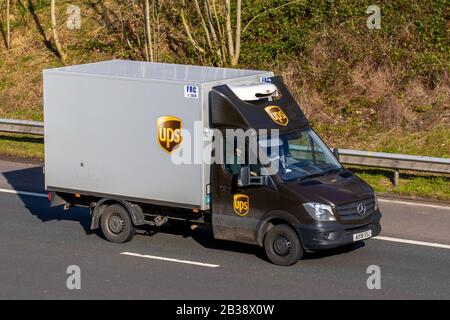 UPS Box van;  United Parcel Service is an American multinational package delivery and supply chain management company; Mercedes Benz sprinter UPS vans travelling on the m6 Motorway, UK Stock Photo