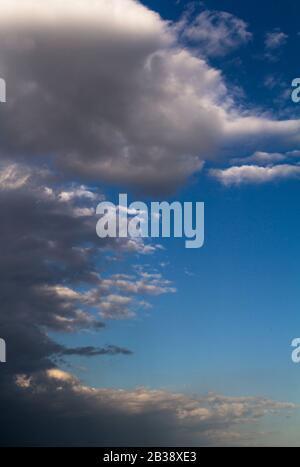 Dramatic stormy gray clouds with blue sky. Stock Photo