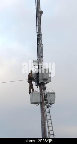 Saint Petersburg, Russia-02 February 2020: Technician maintenance on telecommunication tower. Stock Photo
